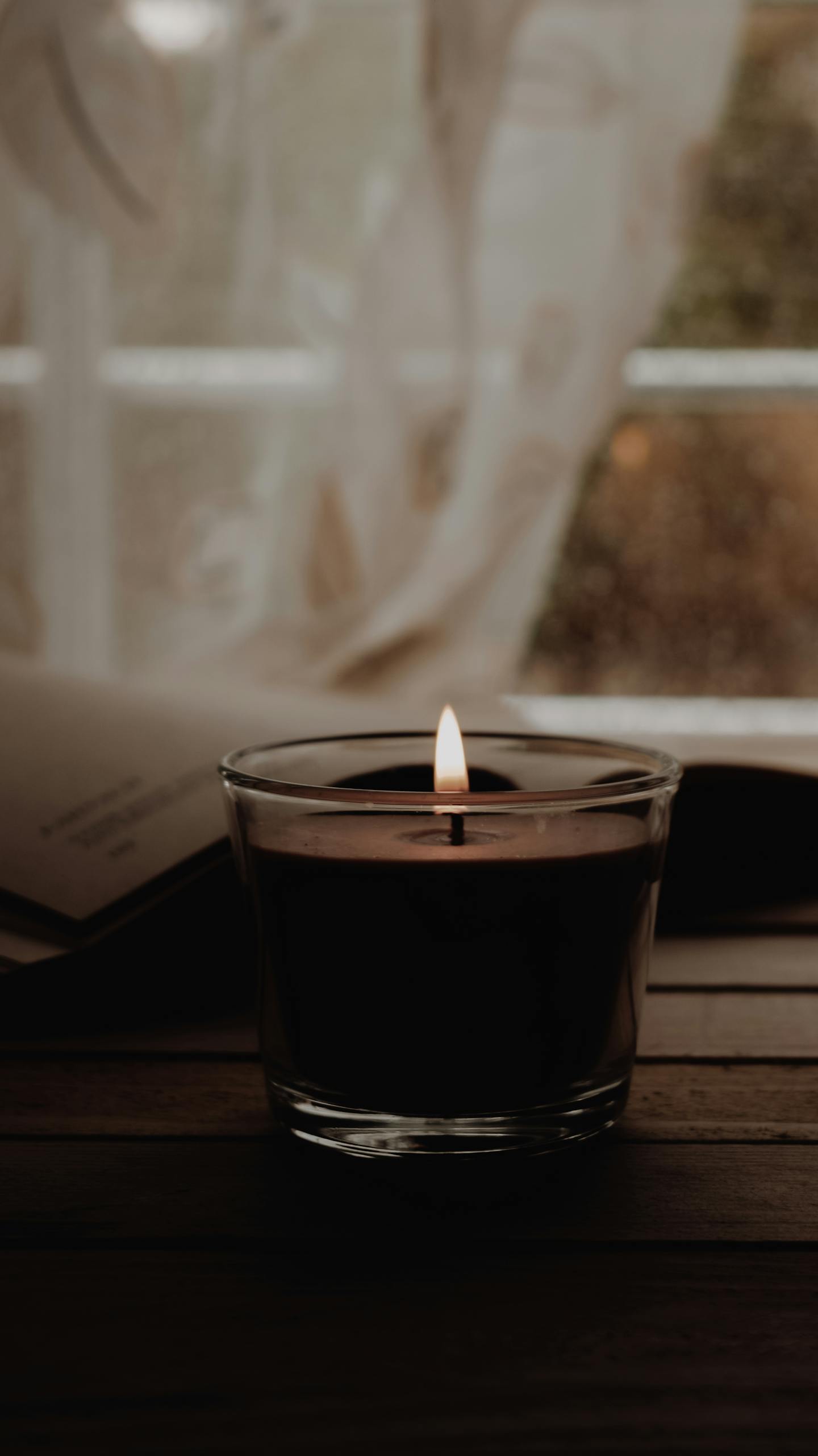 A warm candlelit scene with a softly focused background, perfect for relaxation and meditation.