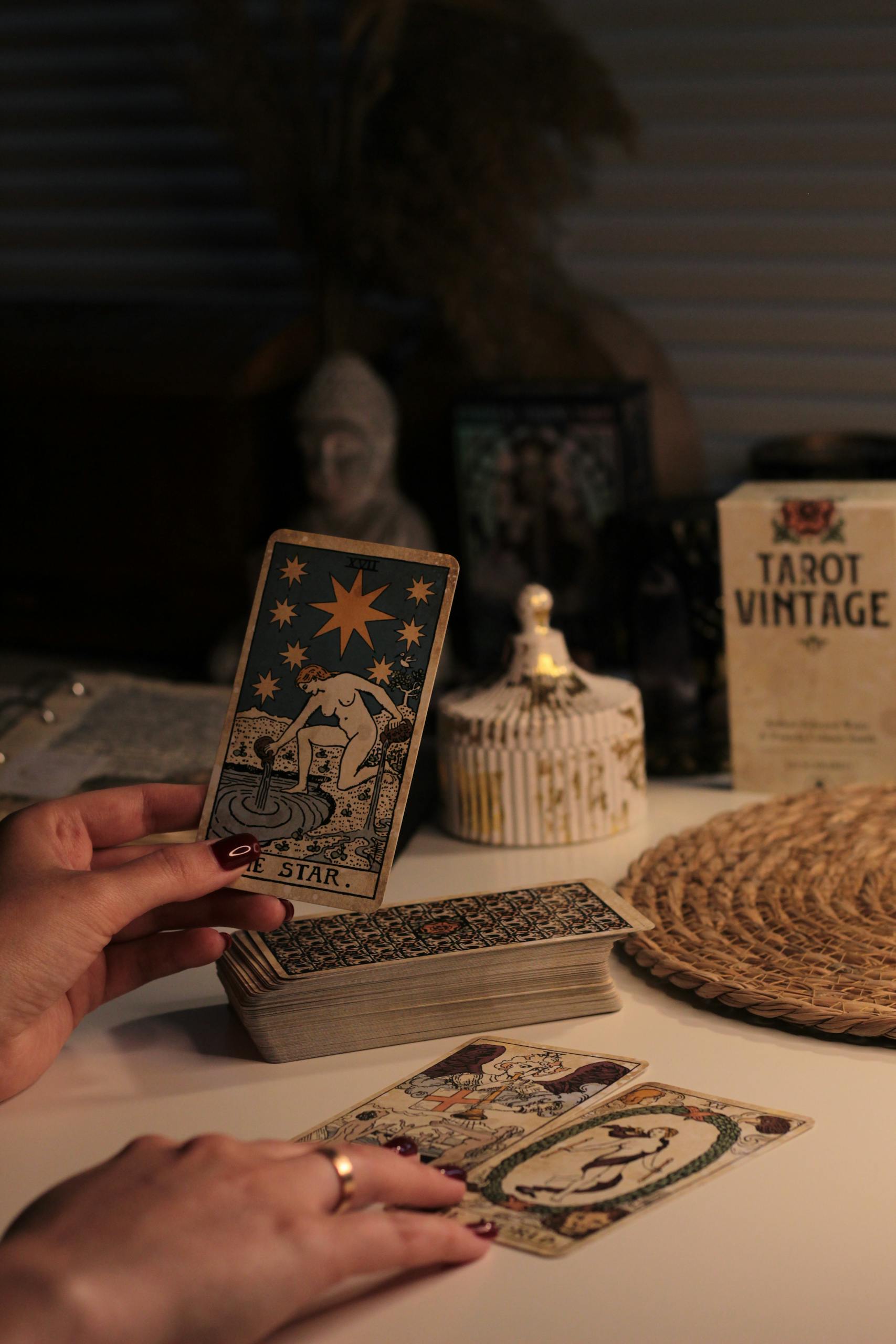 A cozy room with a vintage tarot reading setup featuring The Star card.